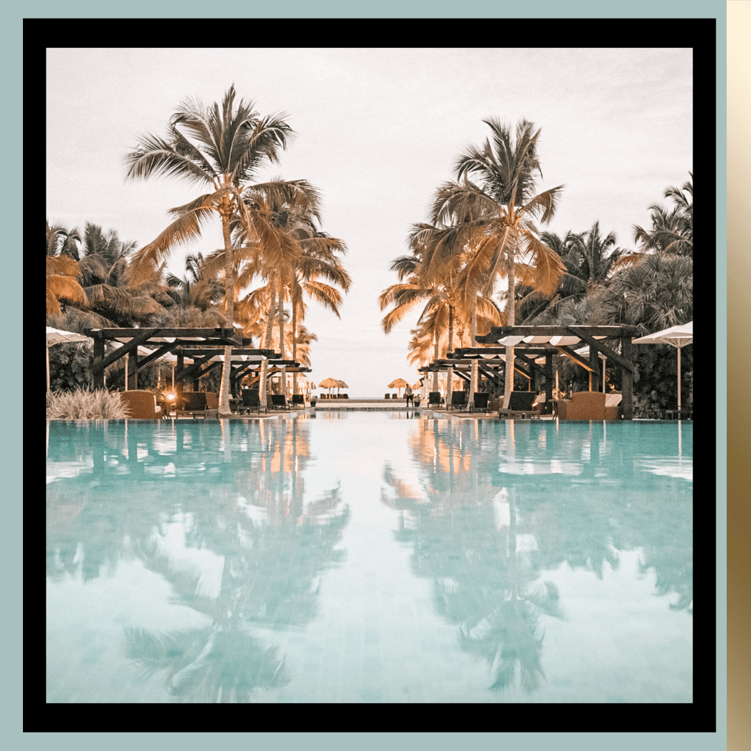 Tropical resort pool with palm trees